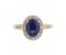 Classic claw set oval blue sapphire with round diamond halo ring