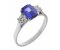 Rosaline emerald cut tanzanite and round diamond trilogy ring