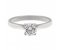 Kiss style round brilliant cut diamond solitaire engagement ring