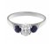 Olivia classic oval shape diamond and round blue sapphire trilogy ring