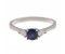 Classic round blue sapphire trilogy ring with pear shape diamond shoulders
