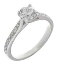Kiss style round diamond solitaire engagement ring with grain set diamond shoulders