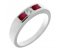 Classic channel set round brilliant cut diamond centre and ruby trilogy ring