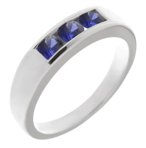 Classic channel set round blue sapphire trilogy ring