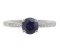 Kiss style round blue sapphire solitaire ring with grain set diamond shoulders top view