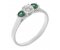 Vienna round brilliant cut diamond and emerald trilogy ring main image