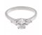 Classic oval cut diamond engagement ring with pear shape side stones angle view