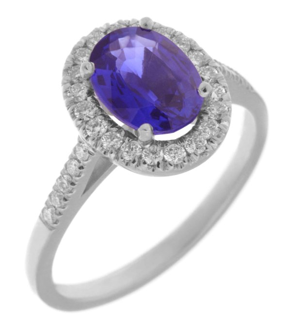 Classic claw set oval tanzanite with round diamond halo ring