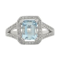 Classic emerald cut aqua and diamond halo cluster ring with split diamond set shoulders