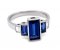 Art deco style baguette cut blue sapphire and diamond ring angle view