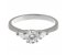 Classic round brilliant cut diamond engagement ring with pear shape side stones