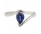 Paris pear shape blue sapphire crossover solitaire ring