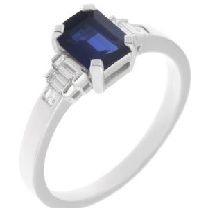 1920's Art Deco style ring octagon shaped emerald cut blue sapphire main stone baguette cut diamonds shoulders platinum gold