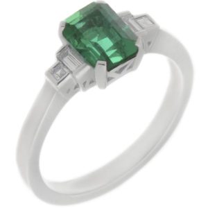 Classic art deco style modern ring emerald cut centre stone stepped graduated baguette cut diamond shoulders setting platinum gold