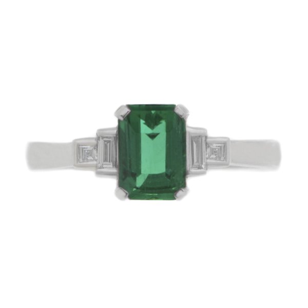 Classic art deco style modern ring emerald cut centre stone stepped graduated baguette cut diamond shoulders setting platinum gold