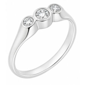 A round brilliant cut diamond trilogy ring in a raised rubover gypsy style setting platinum gold