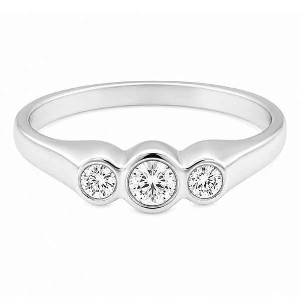 A round brilliant cut diamond trilogy ring in a raised rubover gypsy style setting platinum gold