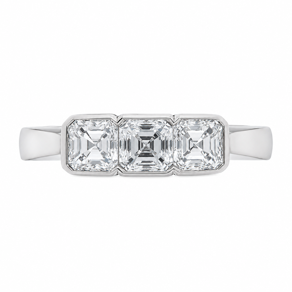 1920's modern classic Art Deco style rubover set Asscher modified square emerald cut diamond trilogy ring platinum gold