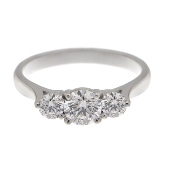 Round brilliant cut diamond trilogy ring platinum gold