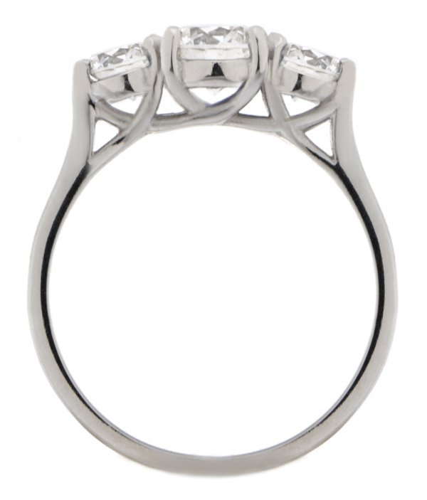Round brilliant cut diamond trilogy ring platinum gold