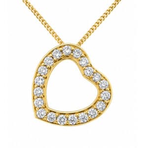 A heart shaped pendant with grain set round brilliant cut diamonds. designed to sit at an angle designer modern pendant gold platinum