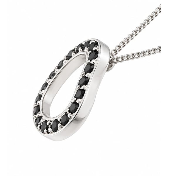 A heart shaped pendant with grain set round black diamonds. designed to sit at an angle designer modern pendant gold platinum