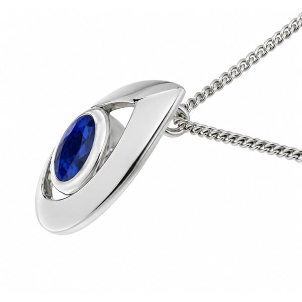 A modernist pear shape tear drop pendant with an oval blue sapphire centre stone in rubover setting. designer modern gold platinum chain