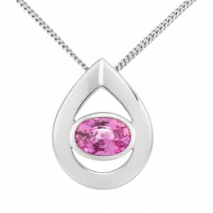 A modernist pear shape tear drop pendant with an oval pink sapphire centre stone in rubover setting designer modern gold platinum chain