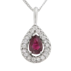 A classic pear shape cut ruby drop pendant with a halo of round brilliant cut diamonds & single bail loop gold platinum chain