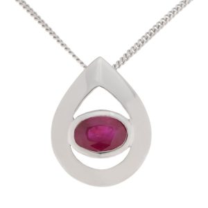 A modernist pear shape tear drop pendant with an oval Ruby centre stone in rubover setting. designer modern gold platinum chain