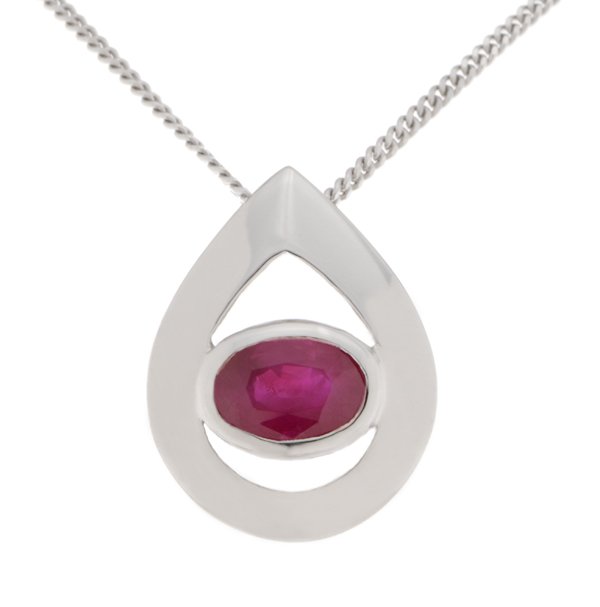 A modernist pear shape tear drop pendant with an oval Ruby centre stone in rubover setting. designer modern gold platinum chain