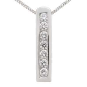 A modernist, contemporary style stick pendant with seven channel set round brilliant cut diamonds, a hidden chain loop. designer modern gold platinum chain