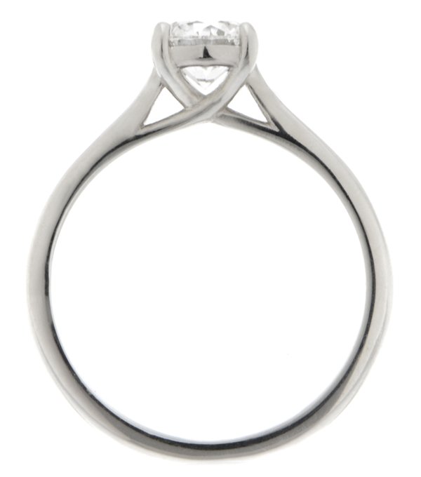 An elegant round brilliant cut diamond solitaire engagement ring kiss style crossover setting platinum gold