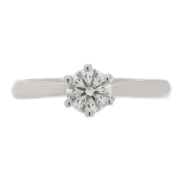 elegant six claw set round brilliant cut diamond solitaire engagement ring with twist style setting gold platinum