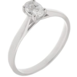 A modern 4 four claw classic solitaire kiss style oval shape cut diamond engagement ring lab grown platinum gold