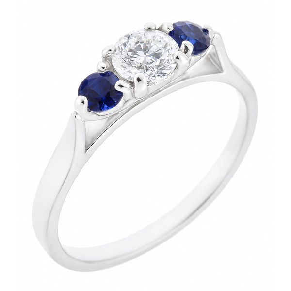 modern classic round brilliant cut diamond trilogy ring with round blue sapphire accent side stones platinum gold three claw set