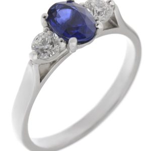 modern classic trilogy ring Oval blue sapphire shape round brilliant cut diamond platinum gold four three claw set