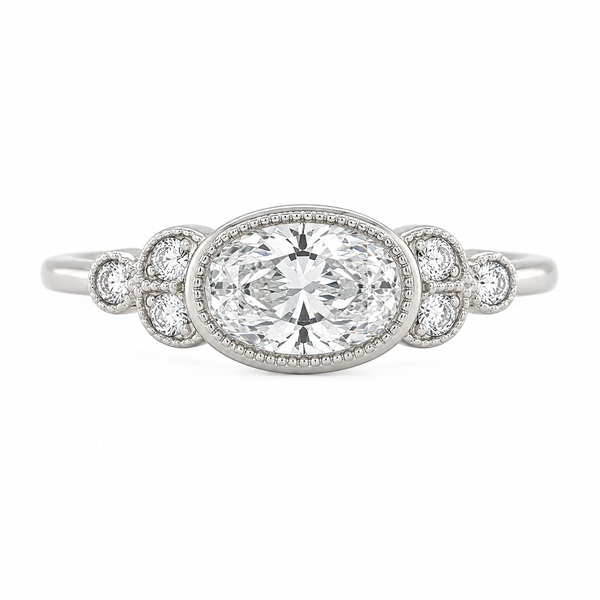 Classic art deco style ring oval shape cut diamond centre stone millgrain round diamonds shoulders vintage engagement platinum gold