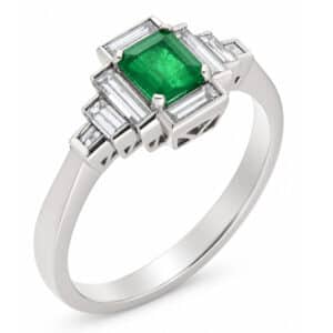 Classic art deco style modern ring green emerald step cut centre stone stepped baguette cut diamonds cluster platinum gold