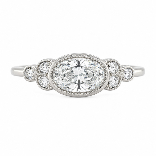 Classic art deco style ring oval shape cut diamond centre stone millgrain round diamonds shoulders vintage engagement platinum gold