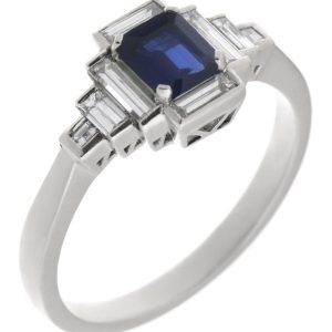 Classic art deco style modern ring emerald step cut blue sapphire centre stone stepped baguette cut diamonds cluster setting platinum gold
