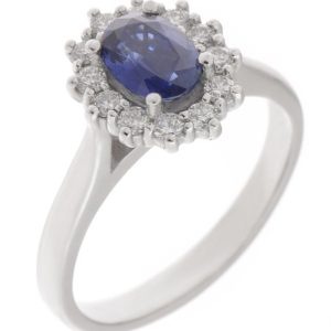 Crystal classic oval shape cut blue sapphire with round brilliant cut diamond halo cluster claw set ring platinum gold