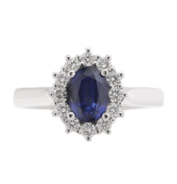 Crystal classic oval shape cut blue sapphire with round brilliant cut diamond halo cluster claw set ring platinum gold