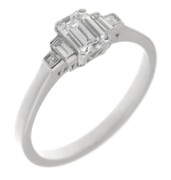 Classic art deco style modern ring emerald cut diamond centre stone stepped graduated baguette cut diamonds shoulders setting platinum gold
