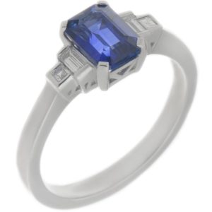 Classic art deco style modern ring emerald step cut blue Sapphire centre stone stepped graduated baguette cut diamond shoulders platinum gold