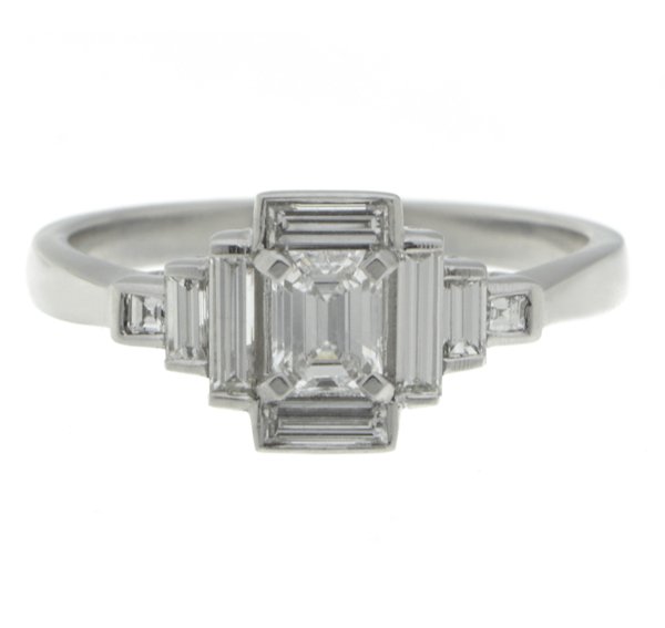 Classic art deco style modern ring emerald cut diamond centre stone stepped baguette cut diamonds cluster setting platinum gold