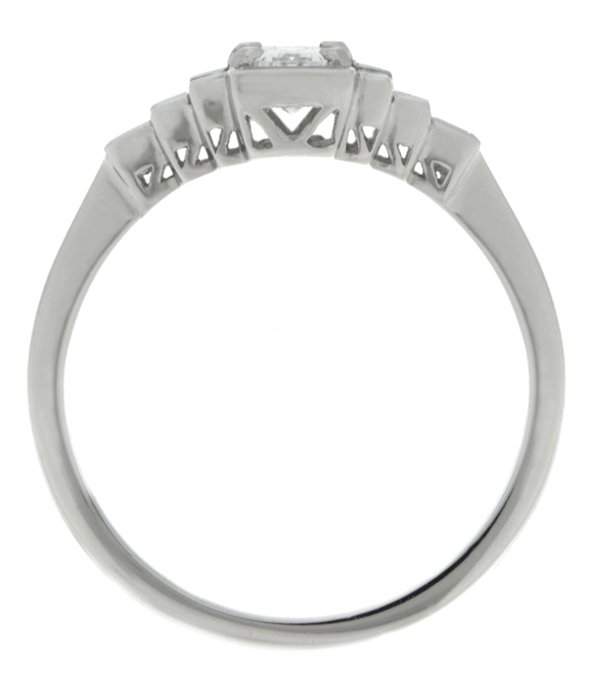 Classic art deco style modern ring emerald cut diamond centre stone stepped baguette cut diamonds cluster setting platinum gold