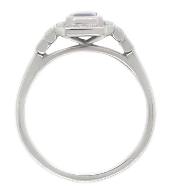 Classic 1920's art deco style emerald cut Blue Sapphire halo ring round brilliant cut diamonds surround stepped shoulders platinum gold