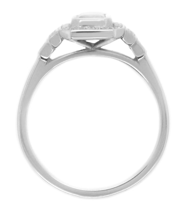 Classic 1920's art deco style emerald cut Diamond halo ring round brilliant cut diamonds surround stepped shoulders platinum gold