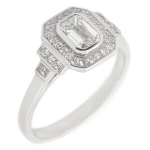 Classic 1920's art deco style emerald cut Diamond halo ring round brilliant cut diamonds surround stepped shoulders platinum gold